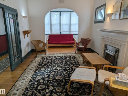8416 104 Street, Edmonton, AB - Indoor Photo Showing Other Room With Fireplace