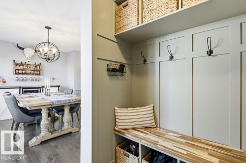 The property features a well-appointed mudroom with a built-in bench, hooks, and overhead shelving, providing practical storage solutions - 16720 15 Avenue, Edmonton, AB - Indoor