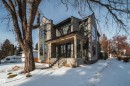 The property features a stone facade, a covered porch with pillars, and a prominent bay window - 13804 85 Avenue, Edmonton, AB  - Outdoor 