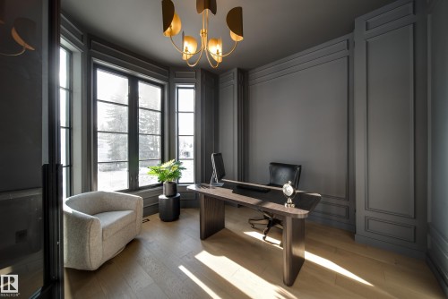 This room features bay windows, hardwood floors, and detailed wall paneling - 13804 85 Avenue, Edmonton, AB - Indoor