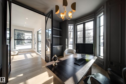 This office features a distinctive bay window design, providing ample natural light - 13804 85 Avenue, Edmonton, AB - Indoor Photo Showing Office