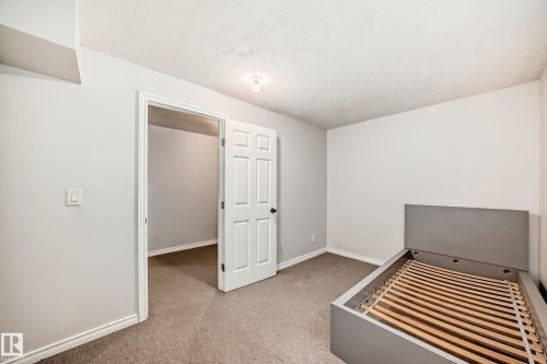Unfurnished bedroom with light colored carpet and baseboards - 14 Spring Gate, Spruce Grove, AB - Indoor