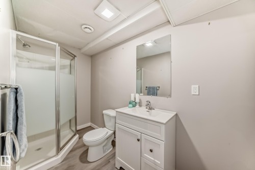Bathroom with vanity, a stall shower, and light wood finished floors - 14 Spring Gate, Spruce Grove, AB - Indoor Photo Showing Bathroom