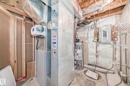 Utilities featuring electric panel and gas water heater - 14 Spring Gate, Spruce Grove, AB - Indoor Photo Showing Basement