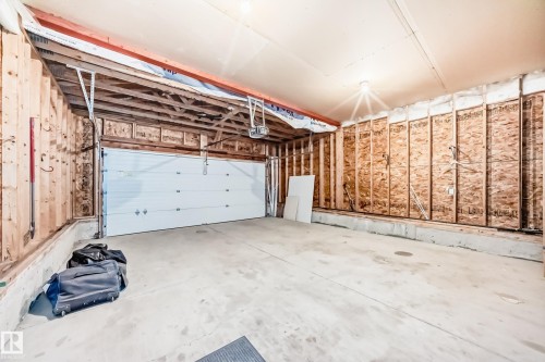 Garage featuring a garage door opener - 14 Spring Gate, Spruce Grove, AB - Indoor Photo Showing Garage
