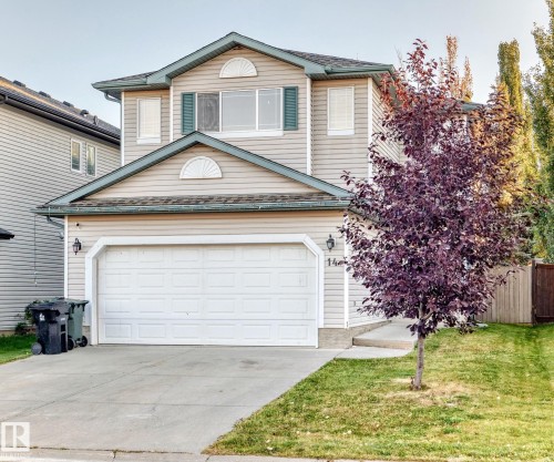 Traditional home featuring concrete driveway, a shingled roof, and an attached garage - 14 Spring Gate, Spruce Grove, AB - Outdoor