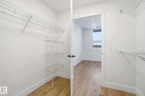 Spacious closet featuring wire shelving and light-toned flooring - 516 260 Bellerose Dr, St. Albert, AB - Indoor With Storage