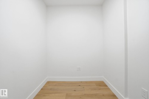 This area features light-colored flooring, white walls, and white baseboards - 516 260 Bellerose Dr, St. Albert, AB - Indoor Photo Showing Other Room
