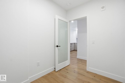 The property features light wood flooring and white walls throughout, creating a bright and airy atmosphere - 516 260 Bellerose Dr, St. Albert, AB - Indoor Photo Showing Other Room