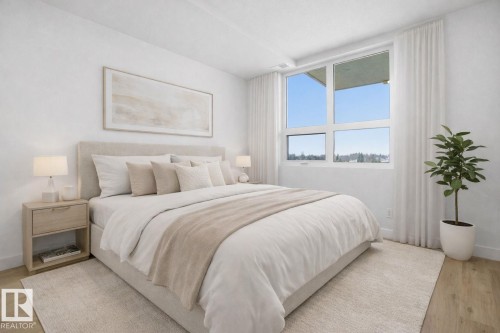 This bedroom features light wood flooring and a large window with white window coverings - 516 260 Bellerose Dr, St. Albert, AB - Indoor Photo Showing Bedroom