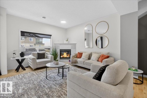 2 3010 33 Avenue, Edmonton, AB - Indoor Photo Showing Living Room With Fireplace