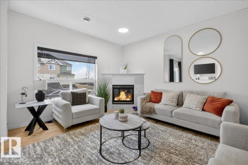 2 3010 33 Avenue, Edmonton, AB - Indoor Photo Showing Living Room With Fireplace