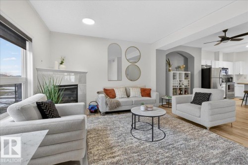 2 3010 33 Avenue, Edmonton, AB - Indoor Photo Showing Living Room With Fireplace