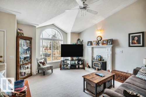 49 Mcleod Crescent, Leduc, AB - Indoor Photo Showing Living Room With Fireplace