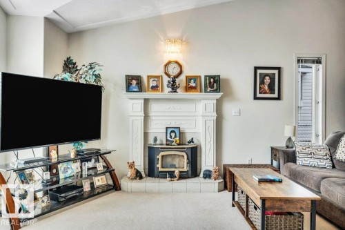 49 Mcleod Crescent, Leduc, AB - Indoor Photo Showing Living Room With Fireplace