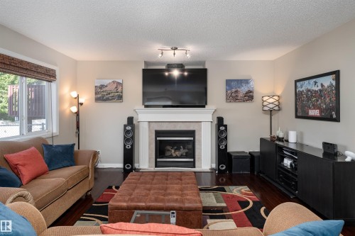 2168 37B Avenue, Edmonton, AB - Indoor Photo Showing Living Room With Fireplace