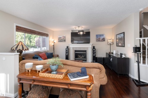 2168 37B Avenue, Edmonton, AB - Indoor Photo Showing Living Room With Fireplace