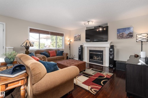 2168 37B Avenue, Edmonton, AB - Indoor Photo Showing Living Room With Fireplace