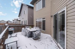 This property features a wooden deck with a privacy fence - 