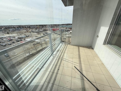 The property features a balcony with tiled flooring and a glass and metal railing - 710 2504 109 Street, Edmonton, AB - 