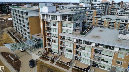 The property is a multi-story building featuring numerous balconies and extensive window areas, showcasing a contemporary architectural design - 710 2504 109 Street, Edmonton, AB - Outdoor