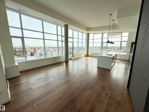 This living area features extensive windows, offering broad views - 710 2504 109 Street, Edmonton, AB - Indoor Photo Showing Other Room