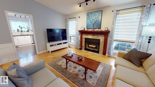 740 Wilkin Close, Edmonton, AB - Indoor Photo Showing Living Room With Fireplace