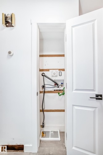 Utility closet with visible plumbing and electrical hookups - 9126 152 St, Edmonton, AB - Indoor