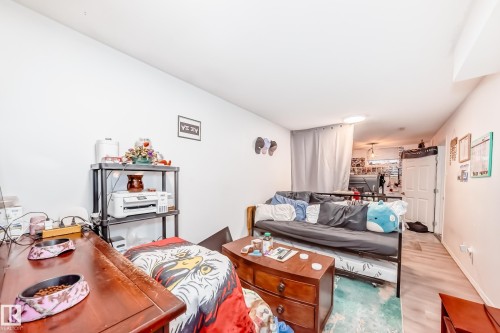 The property features white walls, a light-colored floor, and a ceiling light fixture - 9126 152 St, Edmonton, AB - Indoor Photo Showing Other Room