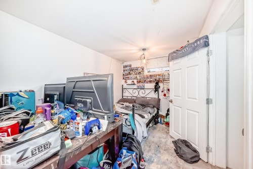 The property features white walls, a white ceiling with a light fixture, and a white paneled door - 9126 152 St, Edmonton, AB - Indoor