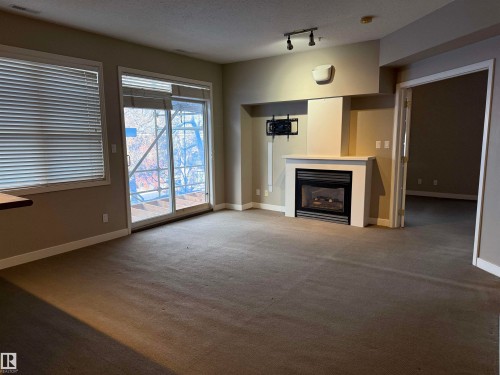 313 10717 83 Avenue, Edmonton, AB - Indoor With Fireplace