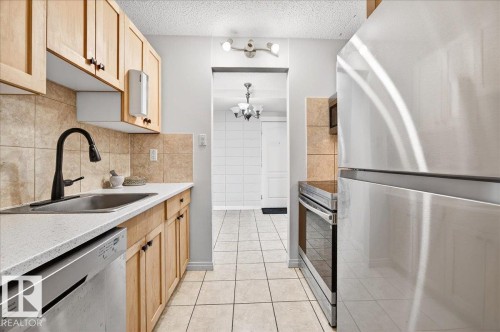 #101 2111 14 St Sw, Calgary, AB - Indoor Photo Showing Kitchen With Upgraded Kitchen