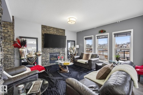 13 Garneau Gate, Spruce Grove, AB - Indoor Photo Showing Living Room With Fireplace