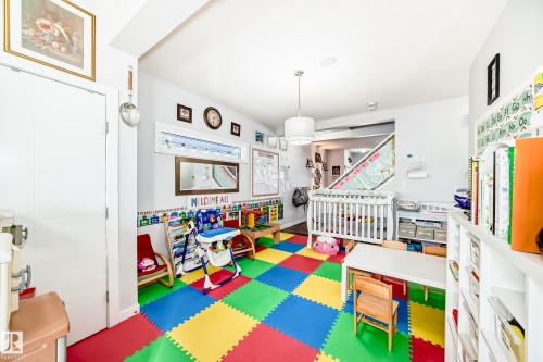 This versatile room features light-colored walls and a colorful tiled floor - 8204 224 Nw, Edmonton, AB - Indoor Photo Showing Other Room