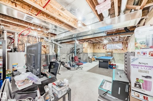 The property features an unfinished basement with exposed wooden beams, concrete flooring, and visible ductwork - 8204 224 Nw, Edmonton, AB - Indoor Photo Showing Basement