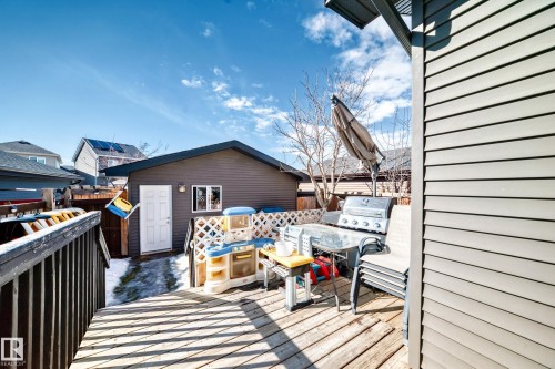 The property features a wooden deck, providing an outdoor entertaining space - 8204 224 Nw, Edmonton, AB - Outdoor With Deck Patio Veranda