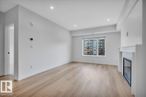 322 7459 May Common Nw, Edmonton, AB - Indoor With Fireplace
