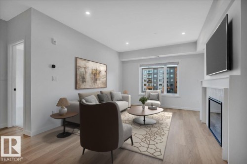 VIRTUALLY STAGED - 322 7459 May Common Nw, Edmonton, AB - Indoor With Fireplace