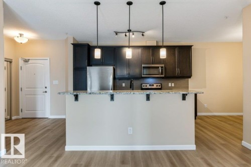 206 6083 Maynard Way, Edmonton, AB - Indoor Photo Showing Kitchen With Upgraded Kitchen