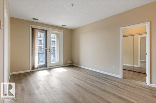 206 6083 Maynard Way, Edmonton, AB - Indoor Photo Showing Other Room