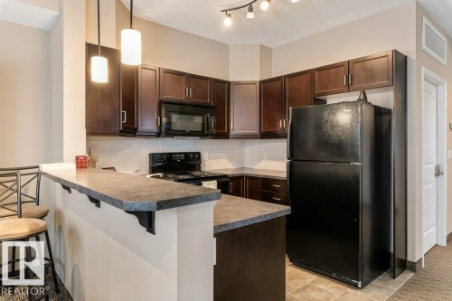 206 6083 Maynard Way, Edmonton, AB - Indoor Photo Showing Kitchen