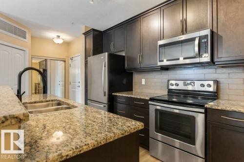 206 6083 Maynard Way, Edmonton, AB - Indoor Photo Showing Kitchen With Stainless Steel Kitchen With Double Sink With Upgraded Kitchen