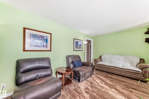 Living room with wood finished floors and baseboards - 3634 113 Avenue, Edmonton, AB - Indoor Photo Showing Living Room