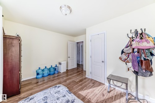 Bedroom featuring light wood-type flooring and baseboards - 3634 113 Avenue, Edmonton, AB - Indoor Photo Showing Bedroom