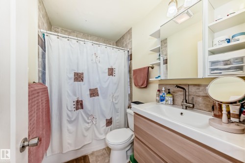 Bathroom with vanity, backsplash, and shower / bathtub combination with curtain - 3634 113 Avenue, Edmonton, AB - Indoor Photo Showing Bathroom