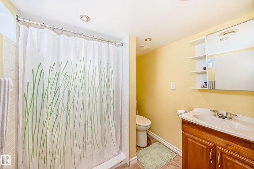 Bathroom with vanity, shower / bath combo with shower curtain, and recessed lighting - 3634 113 Avenue, Edmonton, AB - Indoor Photo Showing Bathroom