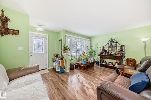 Living room featuring wood finished floors and baseboards - 3634 113 Avenue, Edmonton, AB - Indoor Photo Showing Living Room