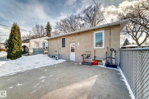 Rear view of house with stucco siding and a patio area - 3634 113 Avenue, Edmonton, AB - Outdoor