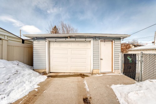 Snow covered garage featuring a detached garage - 3634 113 Avenue, Edmonton, AB - Outdoor With Exterior