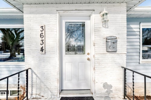 Doorway to property with brick siding and covered porch - 3634 113 Avenue, Edmonton, AB - Outdoor With Exterior